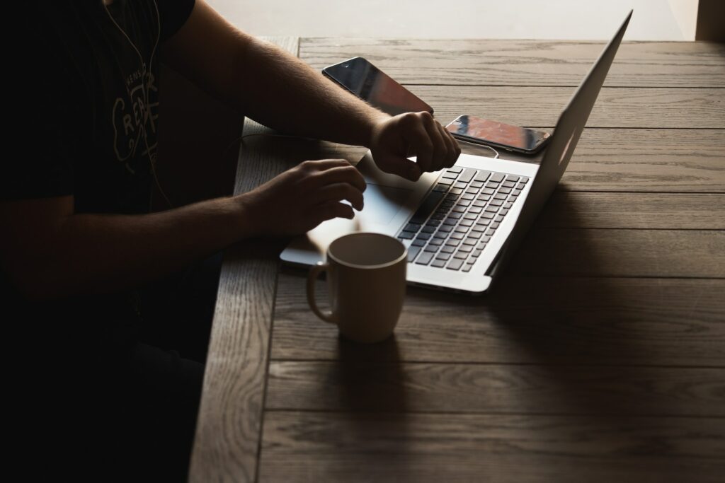 hand typing on computer